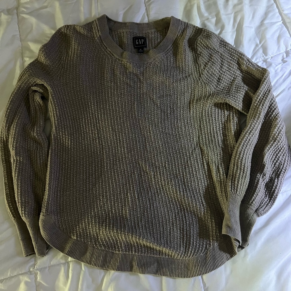 Medium tan sweater.